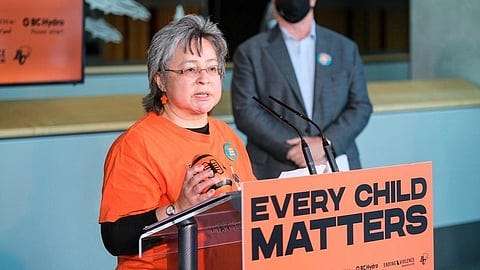 Why do some Canadians wear orange shirts?